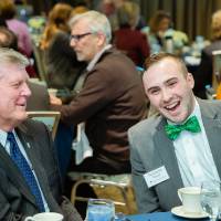 Benjamin Parsell laughing with President Haas at Scholarship Dinner 2019